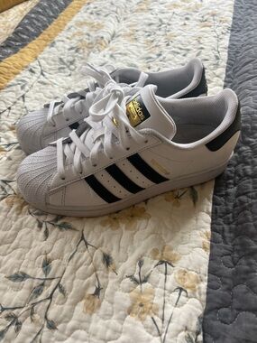 adidas Kids White Sneakers with Black Stripes and Gold Details